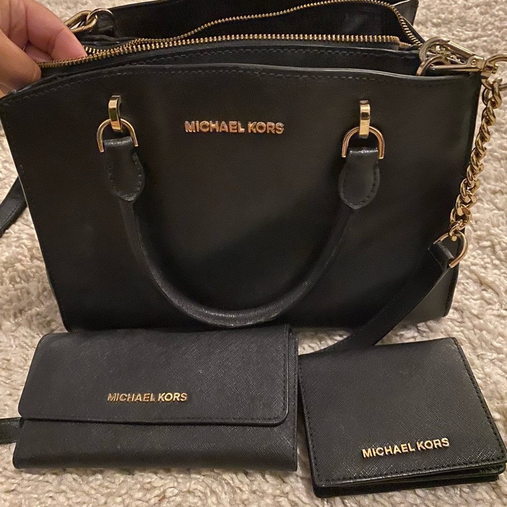 Black Michael Kors purse with matching wallets. Gently used.